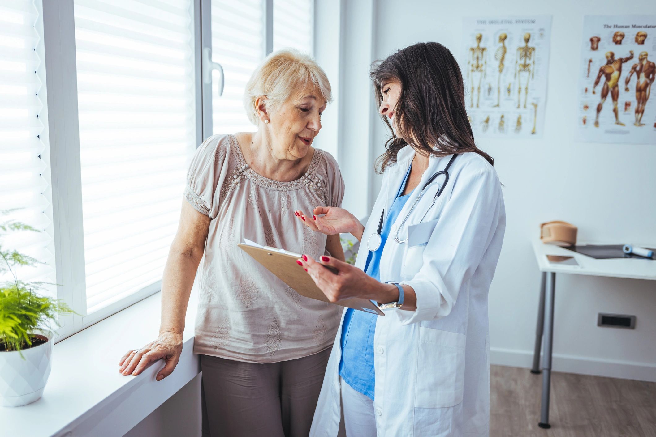 Care professional speaking with an older adult during a supportive consultation