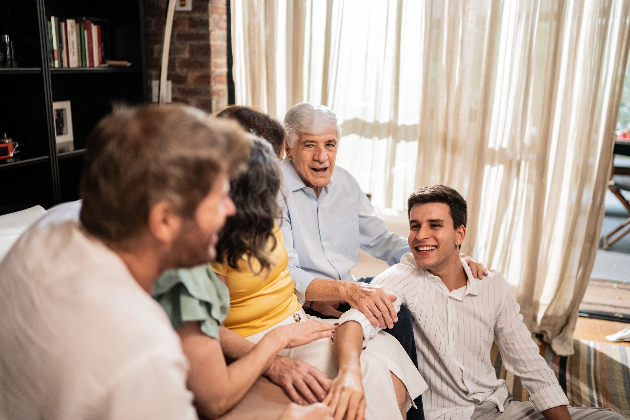 Family meeting together at home while discussing senior care options