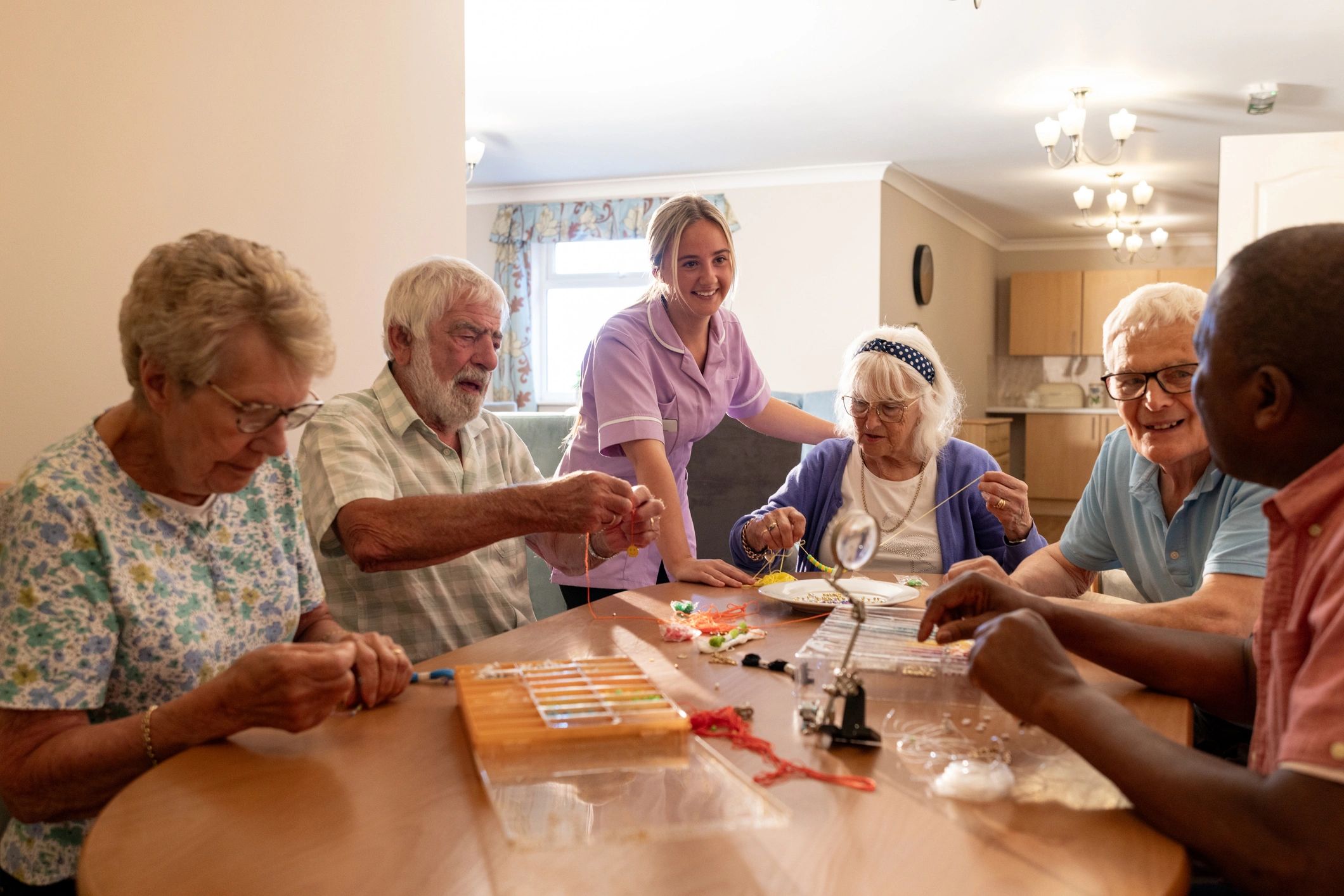 Support worker assisting older adults